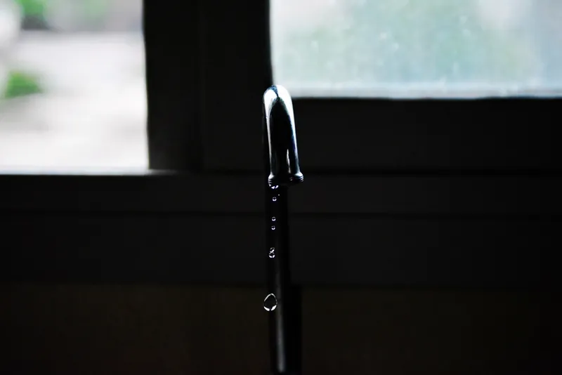 Water dripping from a leaking tap