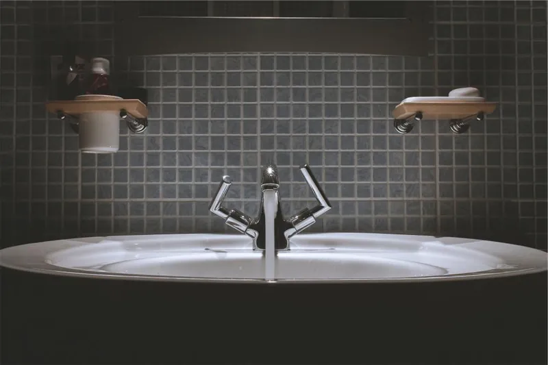 Bathroom washbasin with chrome taps